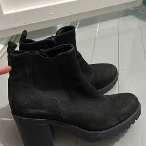 Black heeled boots with zippers